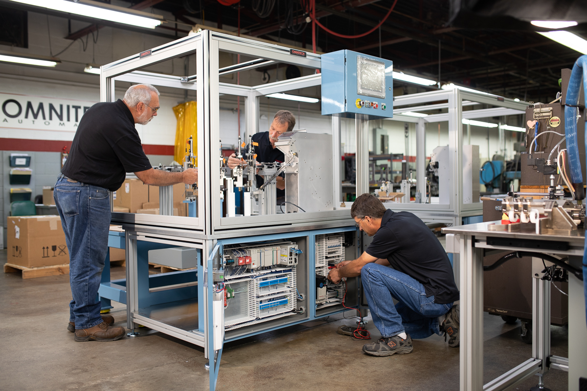 Technicians servicing equipment